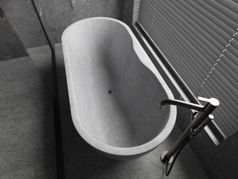 A sleek bathroom in Kahla Grey limestone, a superb relaxation area in a villa in Montreal, Canada
